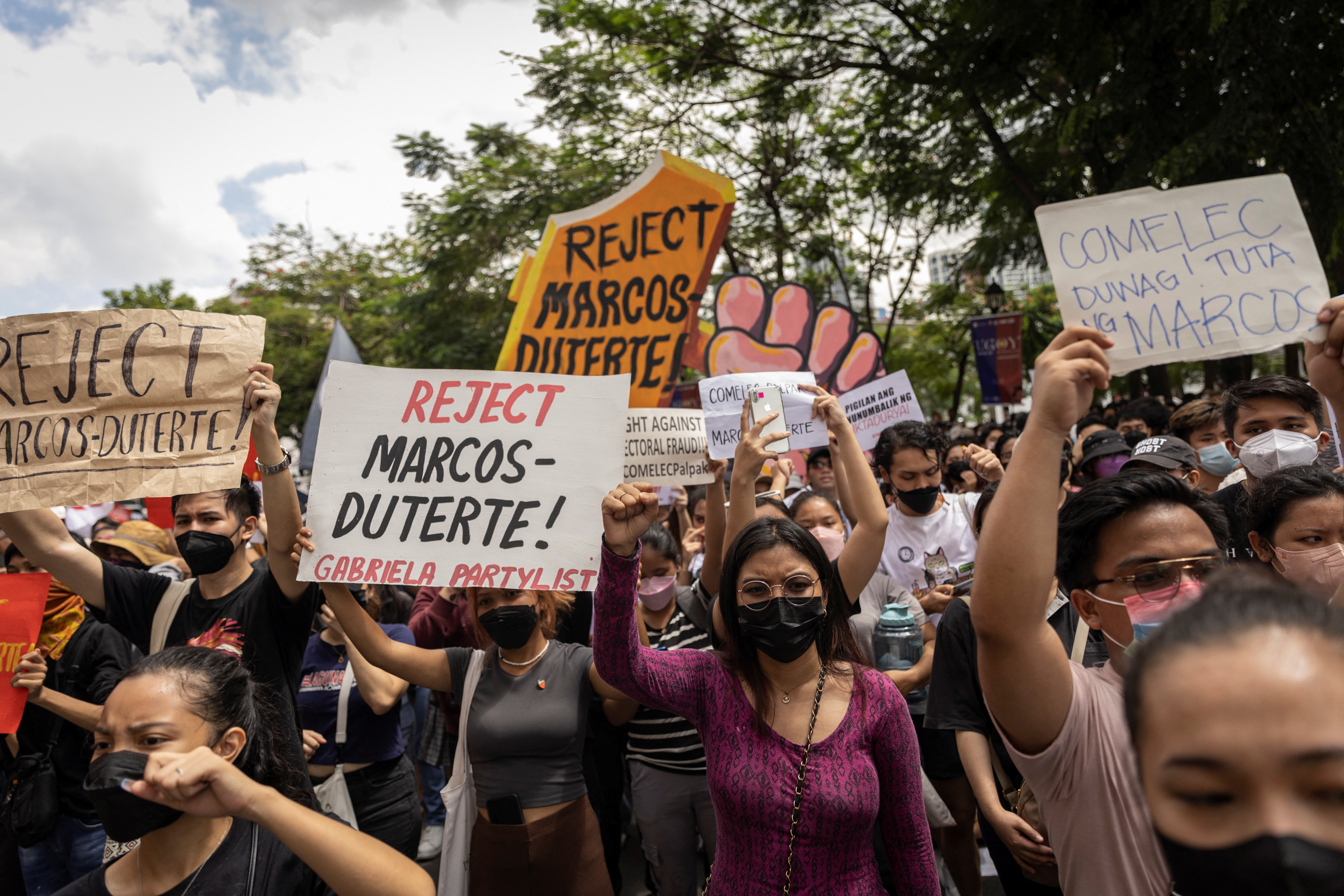 image Protests break out as Philippines election returns a Marcos to presidency