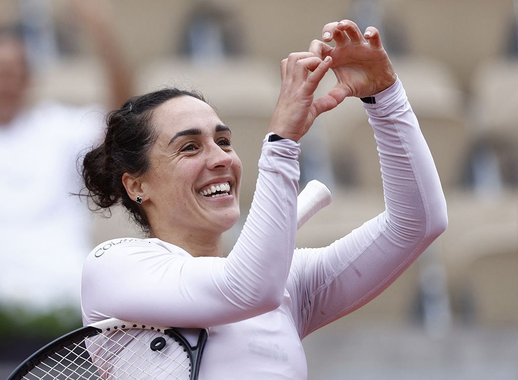 image Trevisan smiles her way into last eight in Paris