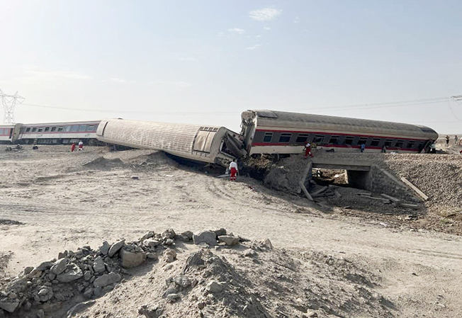 image Iran train derails after excavator collision, at least 18 dead