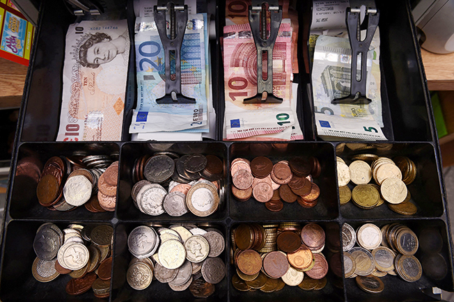image Crises keep demand for cash high, banknote machine company says