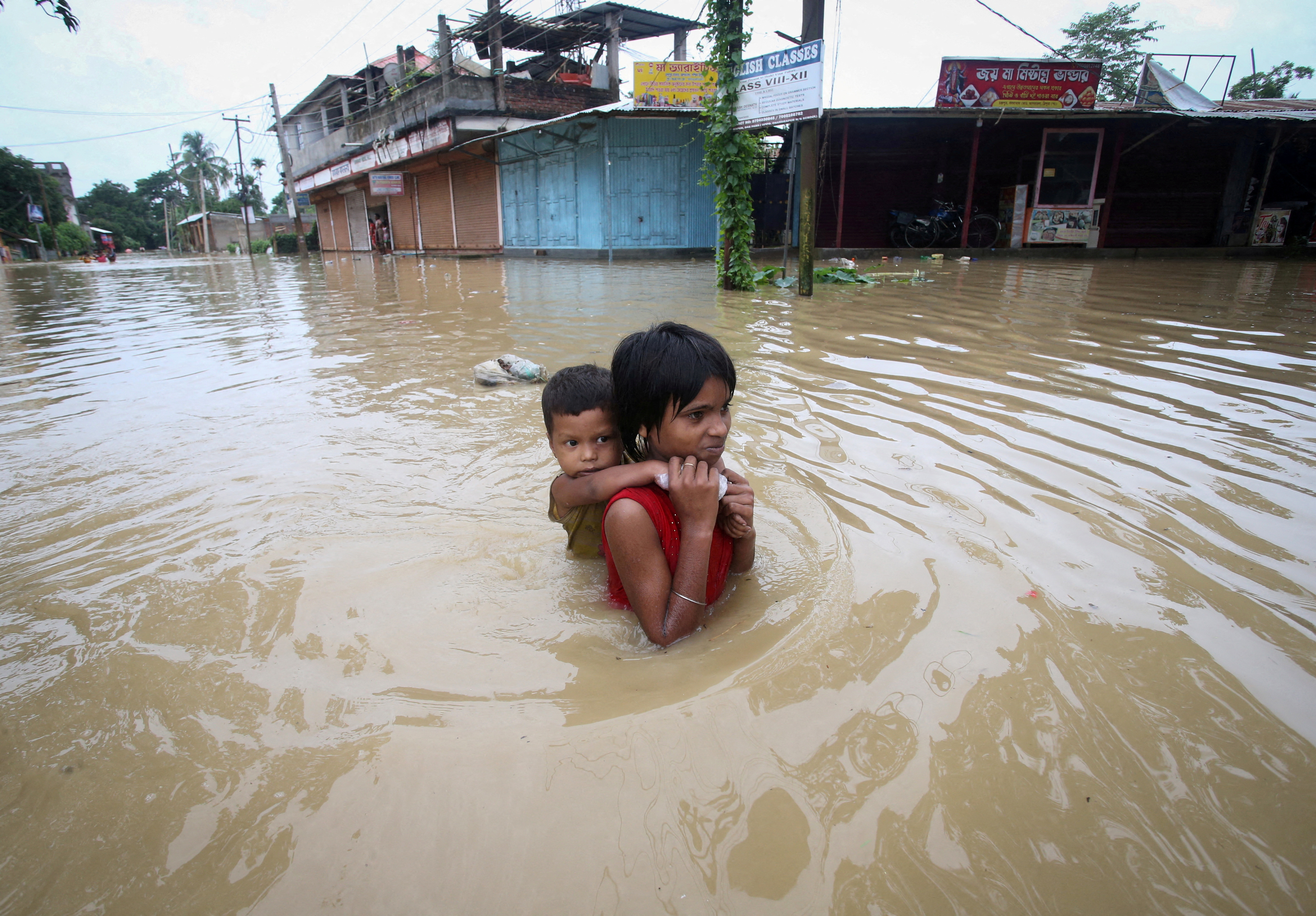 image Monsoon floods kill 42 people, millions stranded in Bangladesh, India