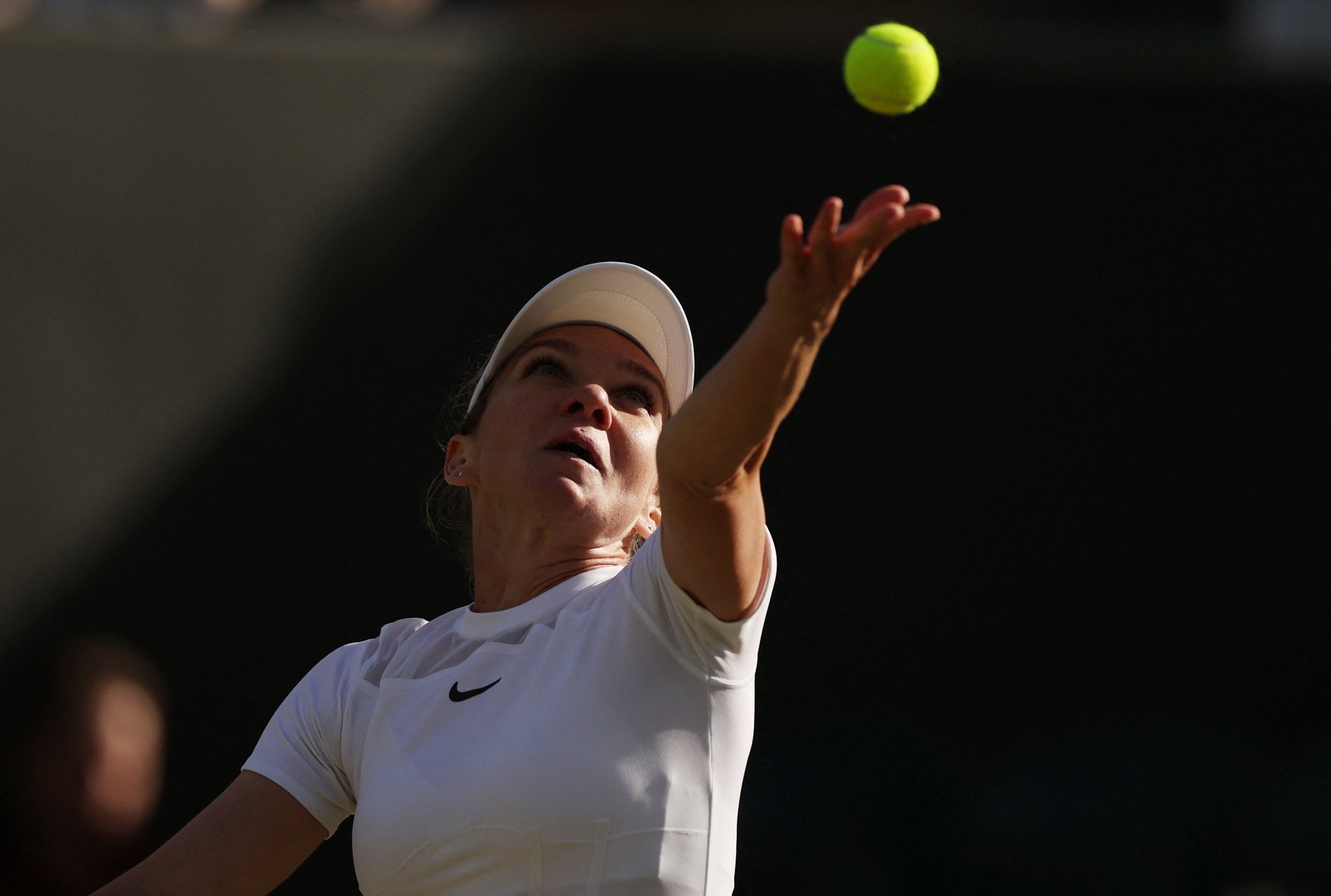 image Former champion Halep rallies to beat retiring Flipkens