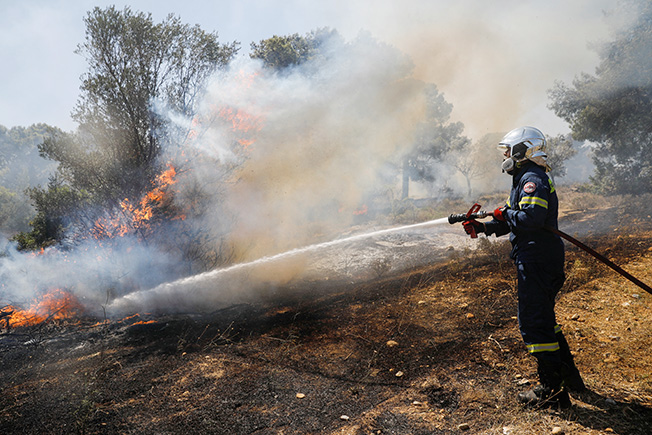 image Greece tames wildfire near Athens, hundreds evacuated