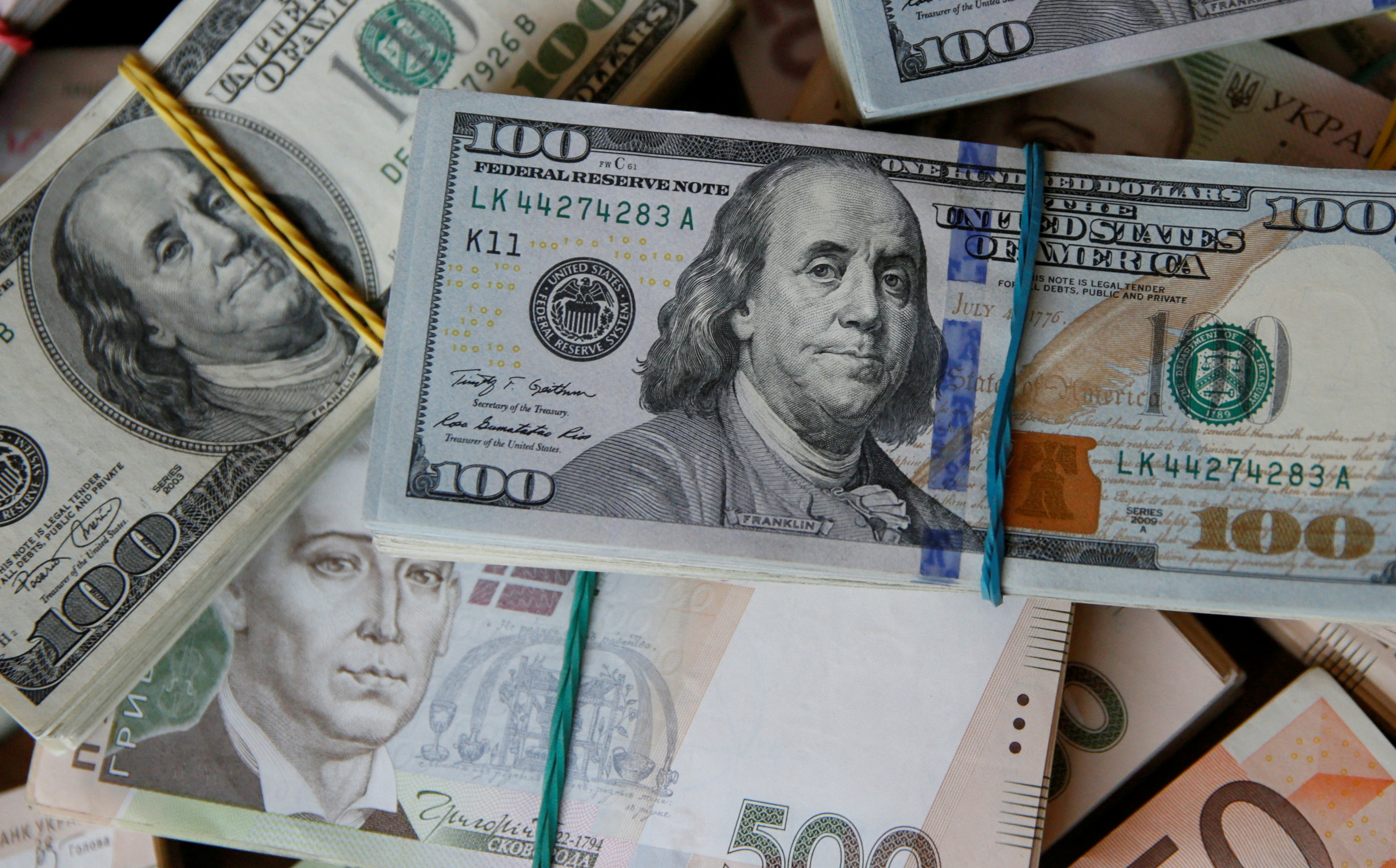 image Ukraine devalues hryvnia currency by 25% against U.S. dollar