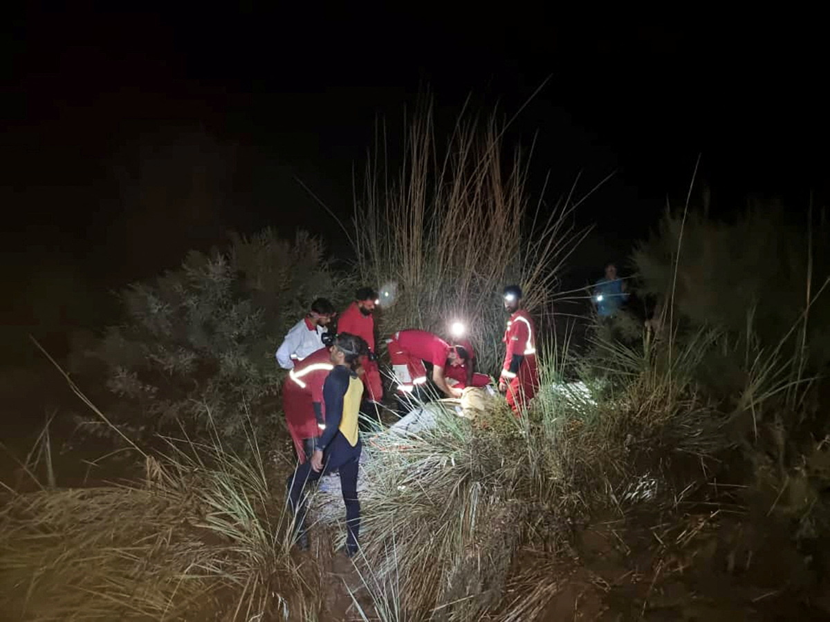 image Floods kill at least 22 in southern Iran, rescuers search for survivors after strong quakes