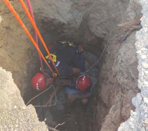 image Anafotia woman rescued after ground collapses under her