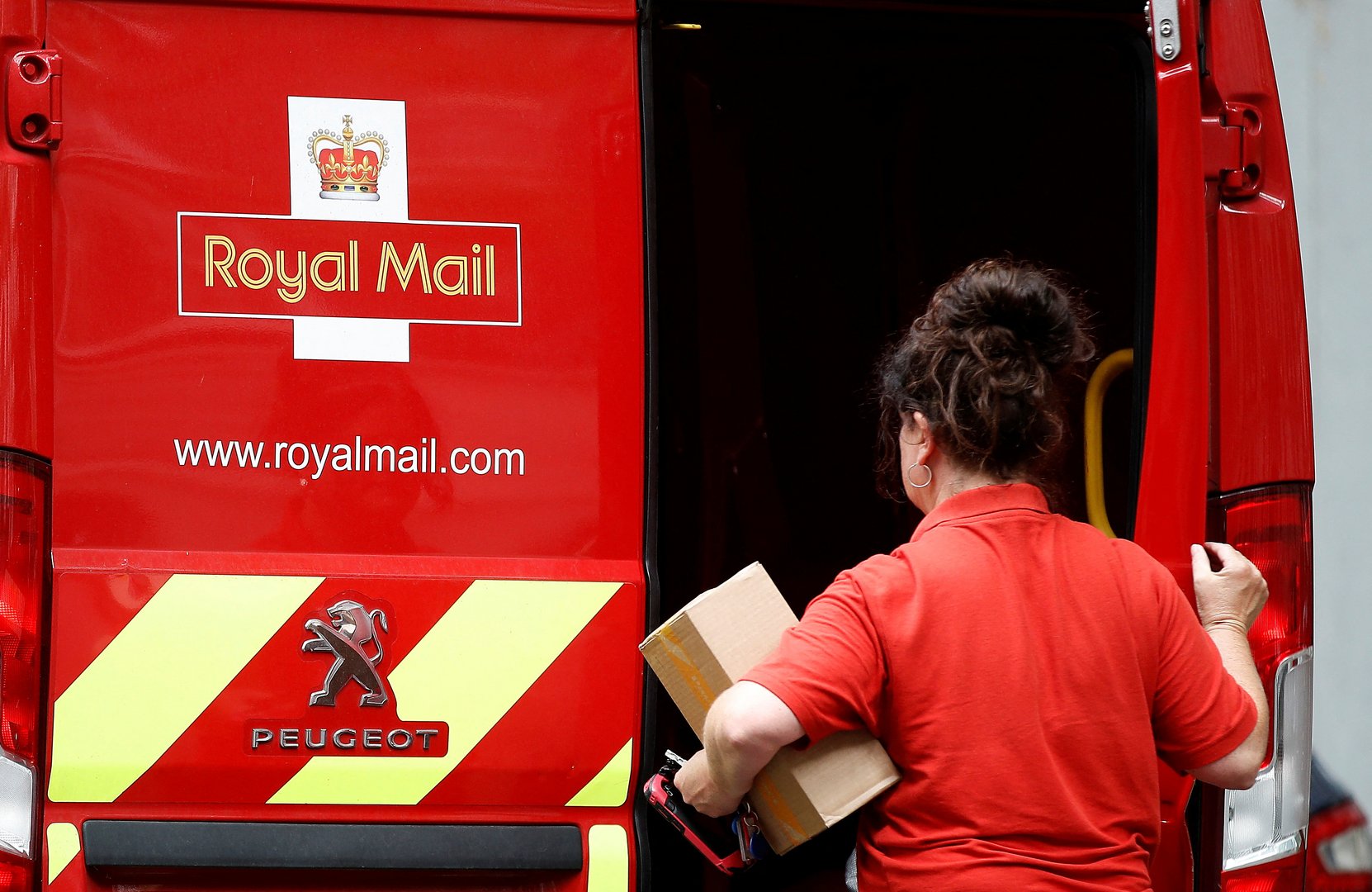 image British postal workers to hold four days of strikes over pay