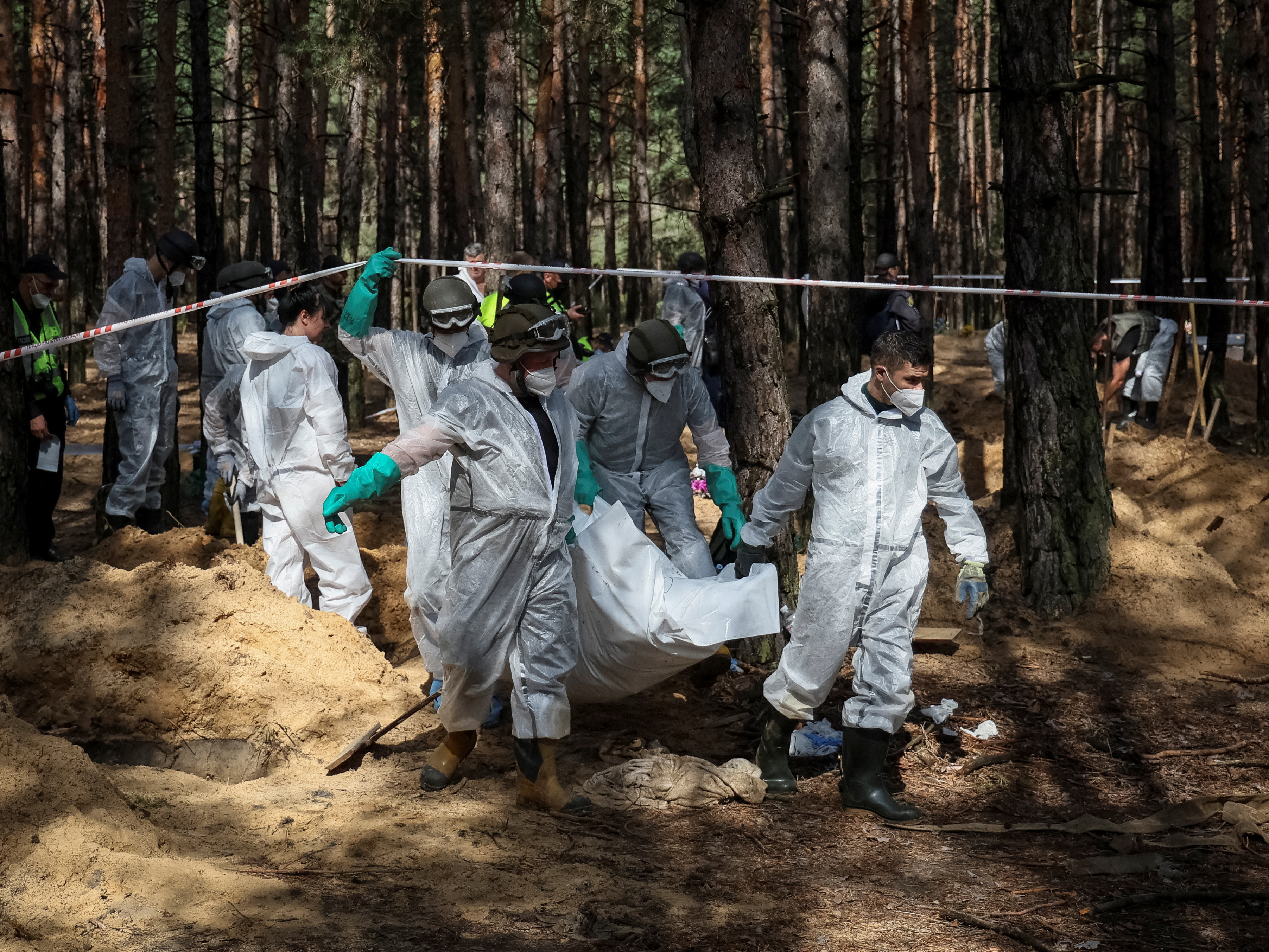 image Ukraine says hundreds of bodies found in mass burial site (Updated)