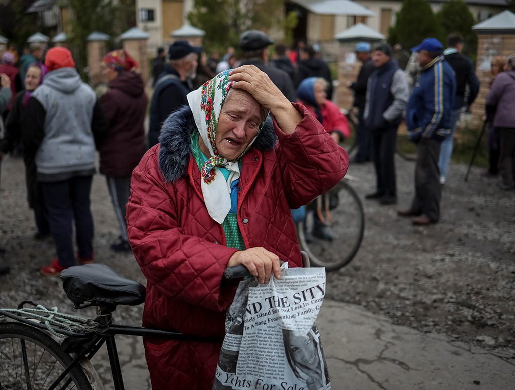 image &#8216;Like Chornobyl&#8217;: Wary Ukrainians return to ruined towns after Russian retreat