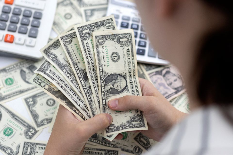 image Dollar sails at two-decade high as Putin rattles markets before Fed