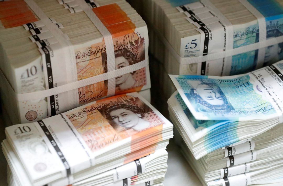 image Sterling slides after BoE buys bonds, dollar hits 20-year high