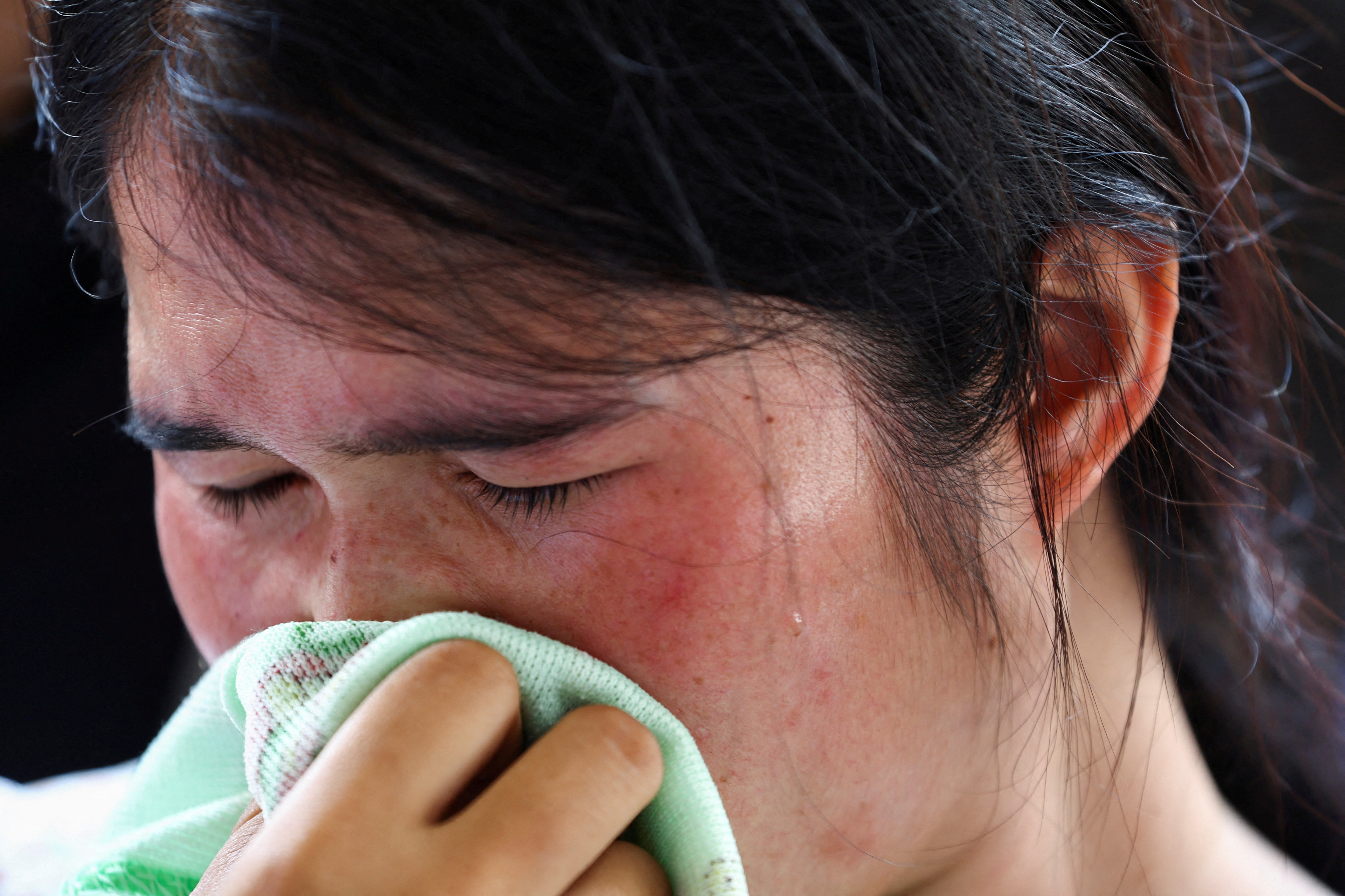 image Day after Thai attack, traumatised relatives cling to slain children&#8217;s toys