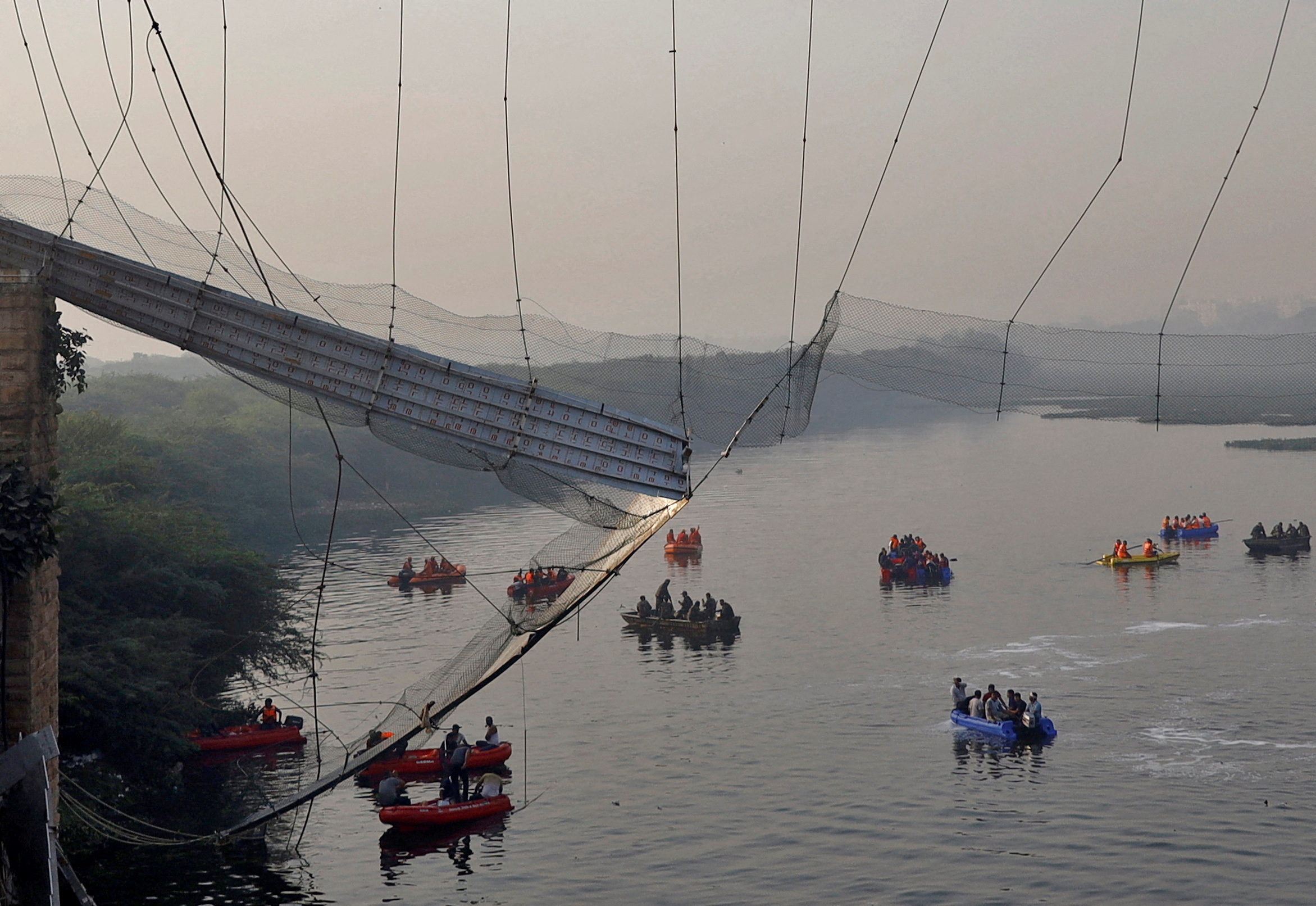 image Death toll from India bridge collapse rises to 132, search on for missing