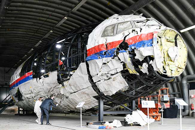 image Dutch court sentences three to life in prison for 2014 downing of MH17