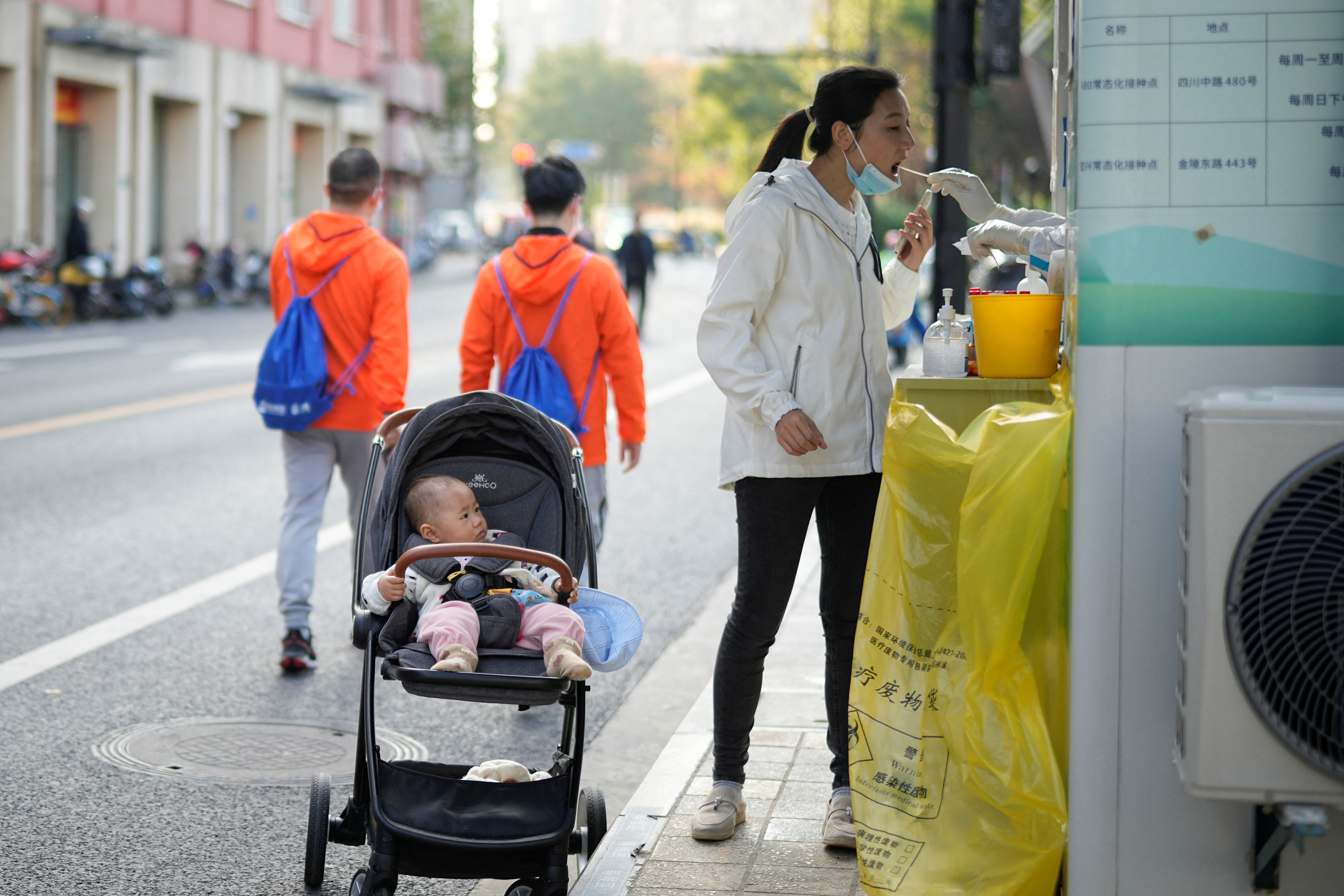 image China reports new daily record COVID cases, curbs tighten across country