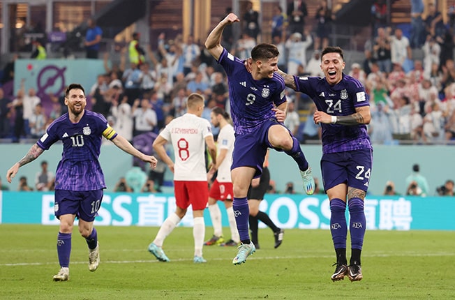 image Argentina beat Poland to set up last 16 clash with Australia