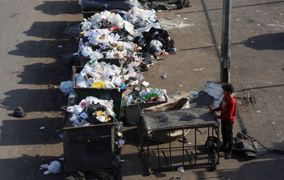 a boy stands near a dumpster in beirut, lebanon november 18 2022 reuters mohamed azakir