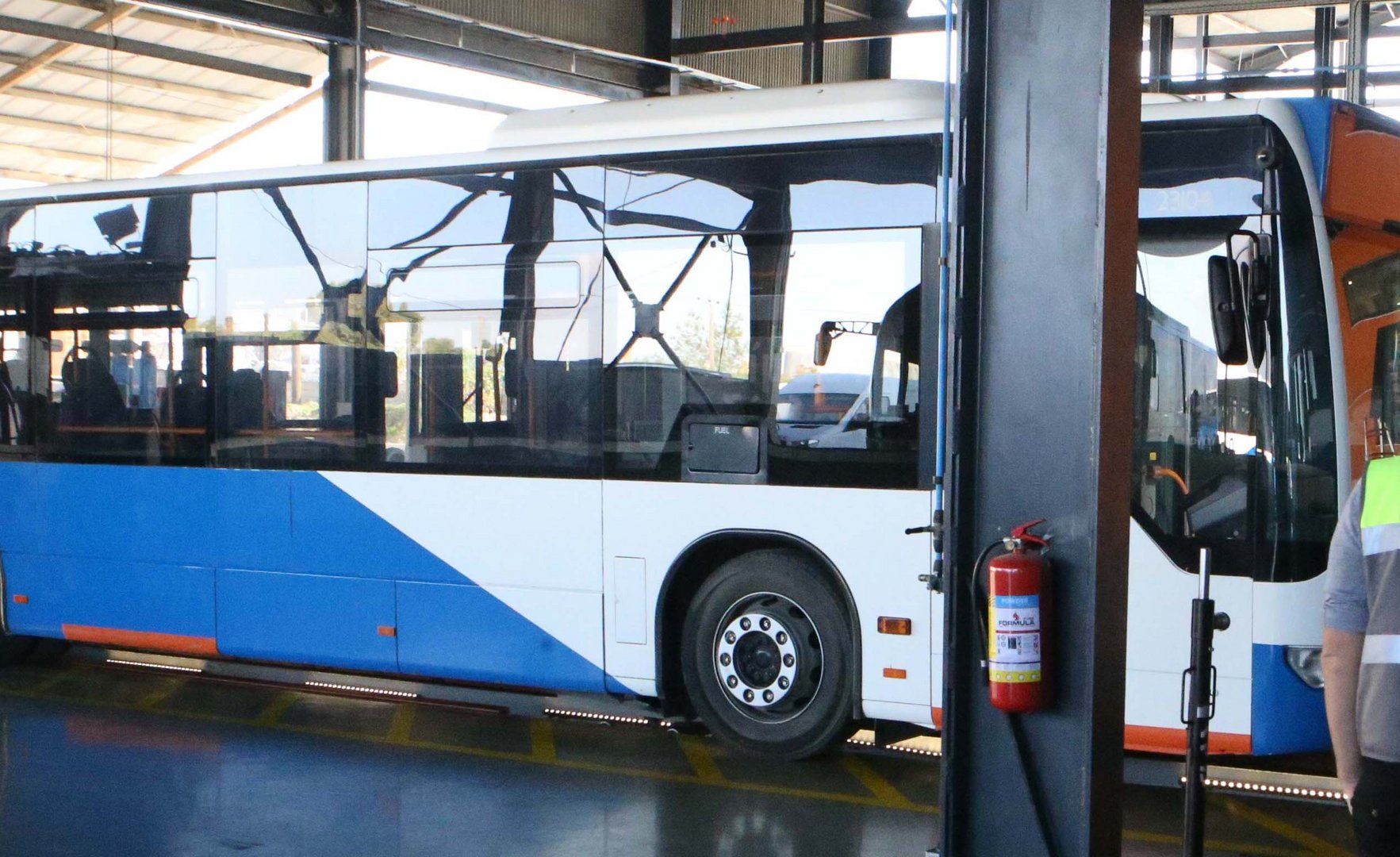 image Bus ended up lodged in store front after traffic accident