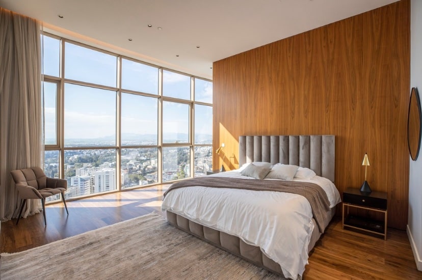 feature gina a bedroom with a wall of windows