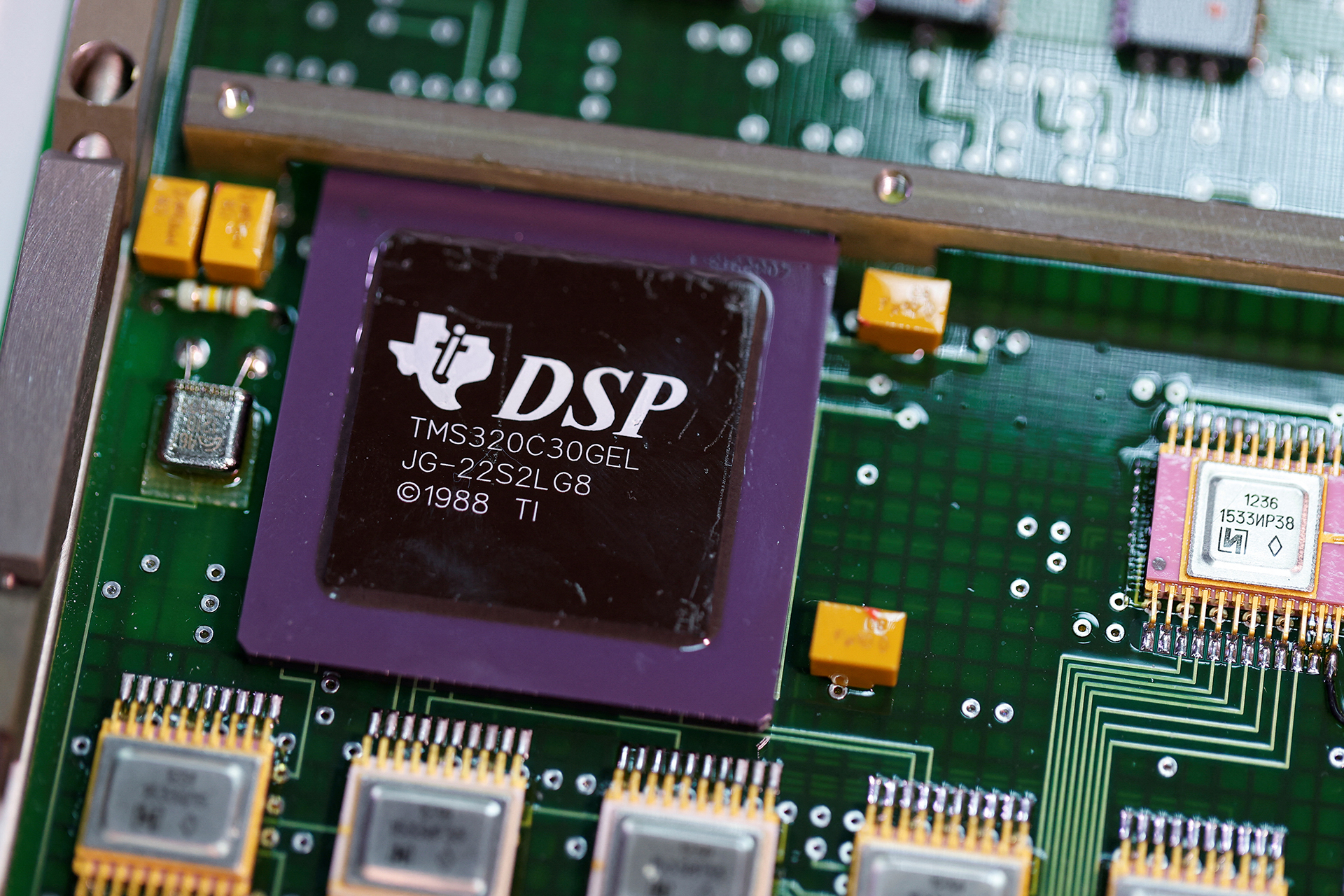 a texas instruments chip dated 1988 is seen on a circuit board found inside a russian 9m727 missile