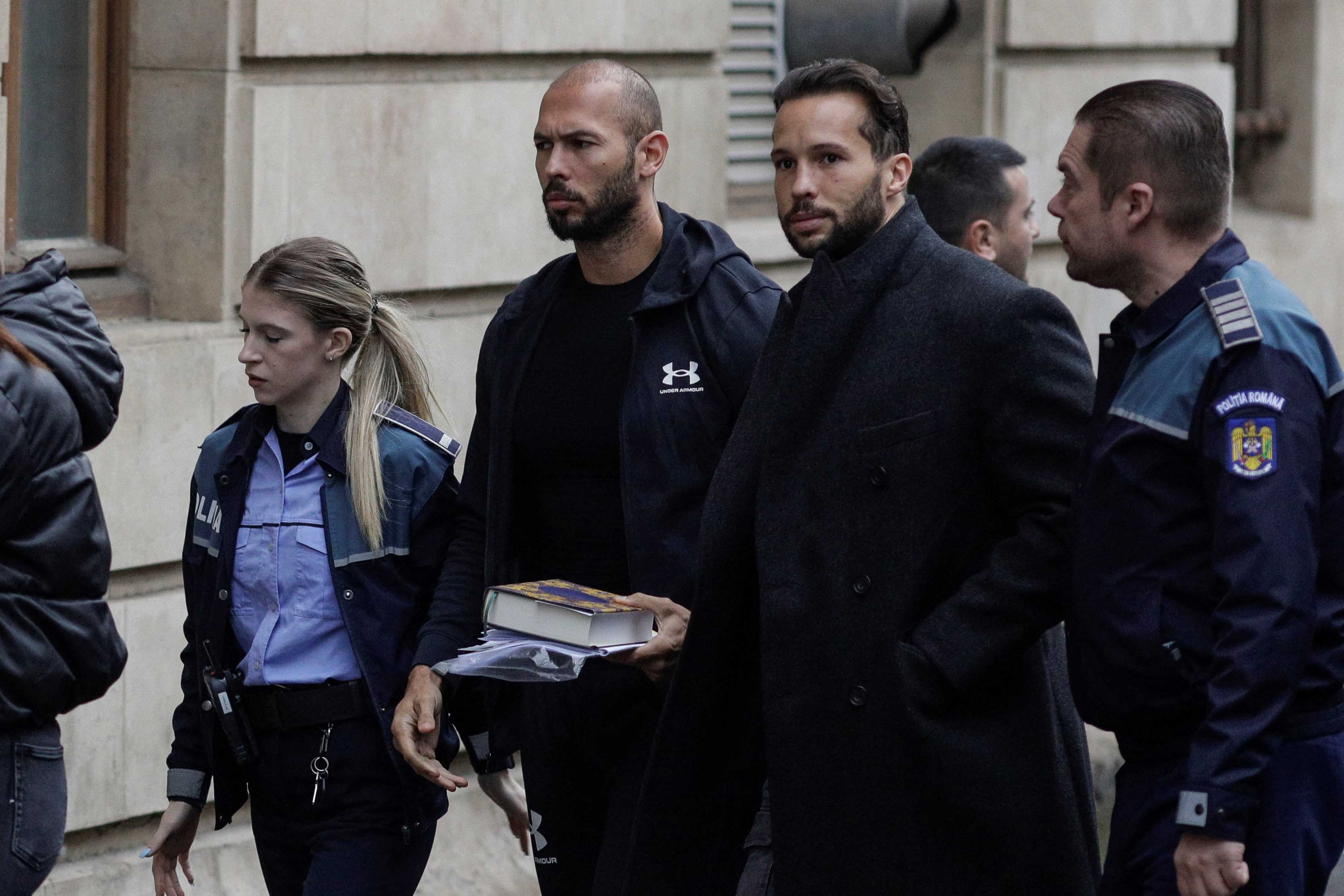 image Romanian prosecutors take away luxury cars seized in Andrew Tate case