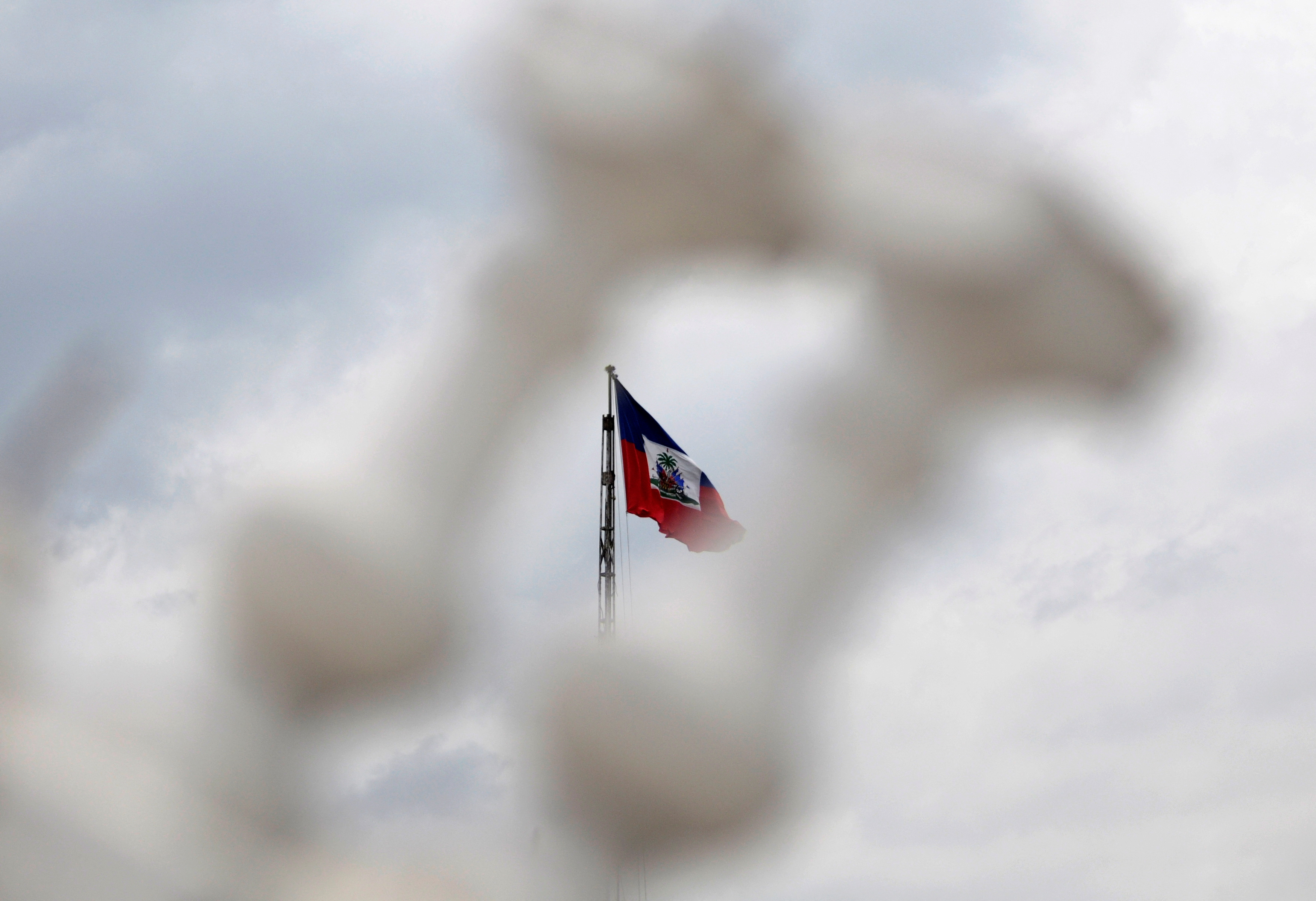 image Haiti police block streets, break into airport to protest officer killings