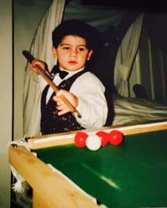 diaspora michael georgiou as a child playing snooker