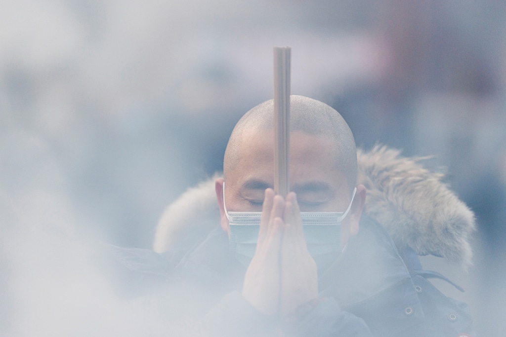 image Chinese pray for health in Lunar New Year as Covid death toll rises