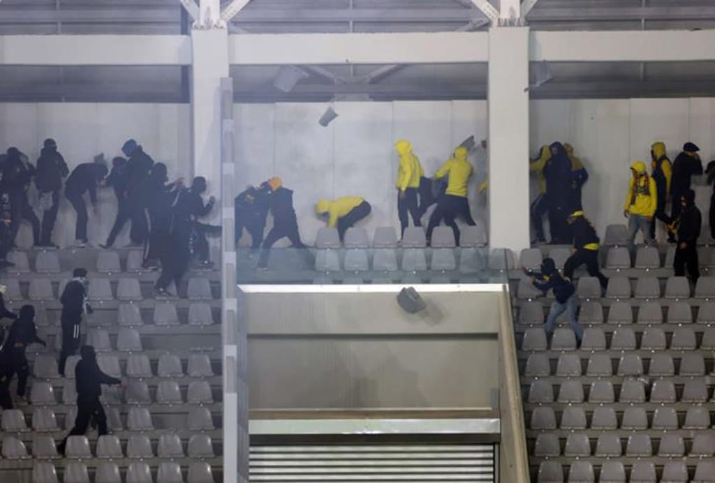 image Two charged in writing after football violence