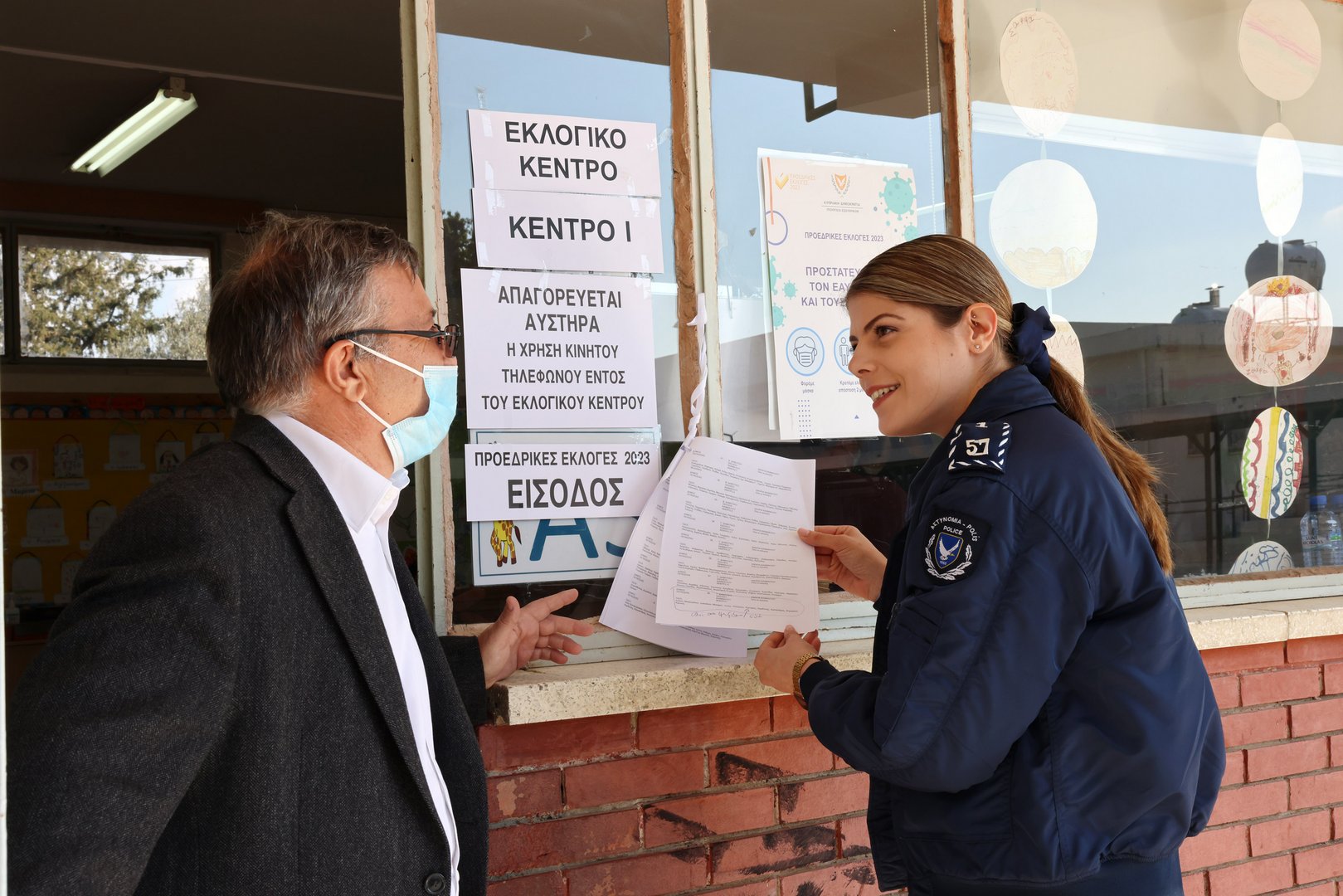 image Police officer at polling station saves worker from choking