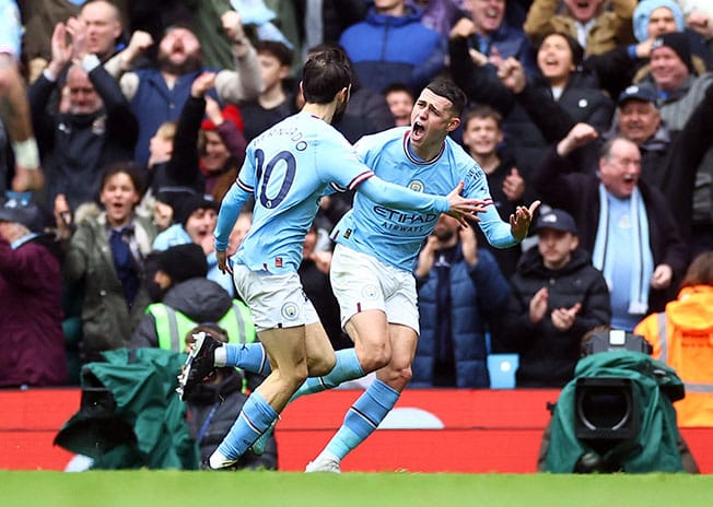 image Man City beat Newcastle 2-0 to maintain pressure on Arsenal