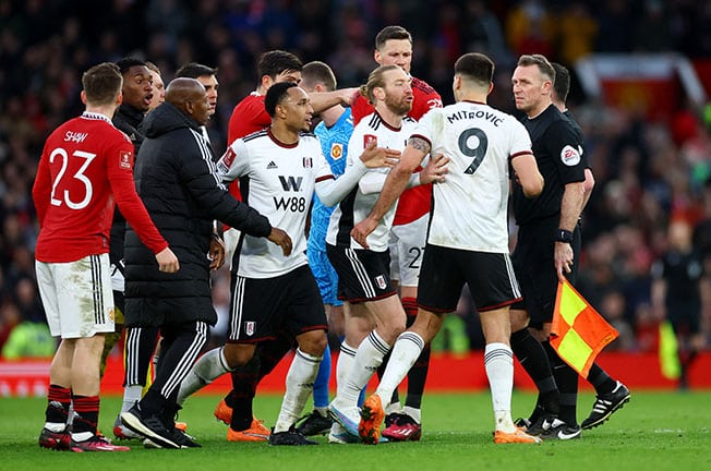 image Man United beat nine-man Fulham to reach semi-finals