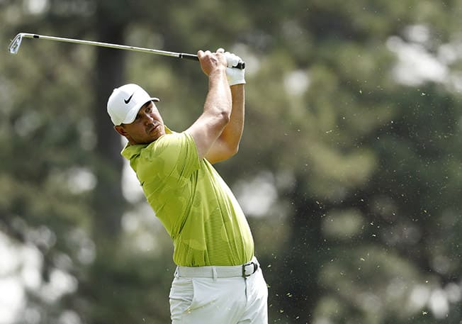 image Three-way tie for Master lead, Woods and McIlroy struggle
