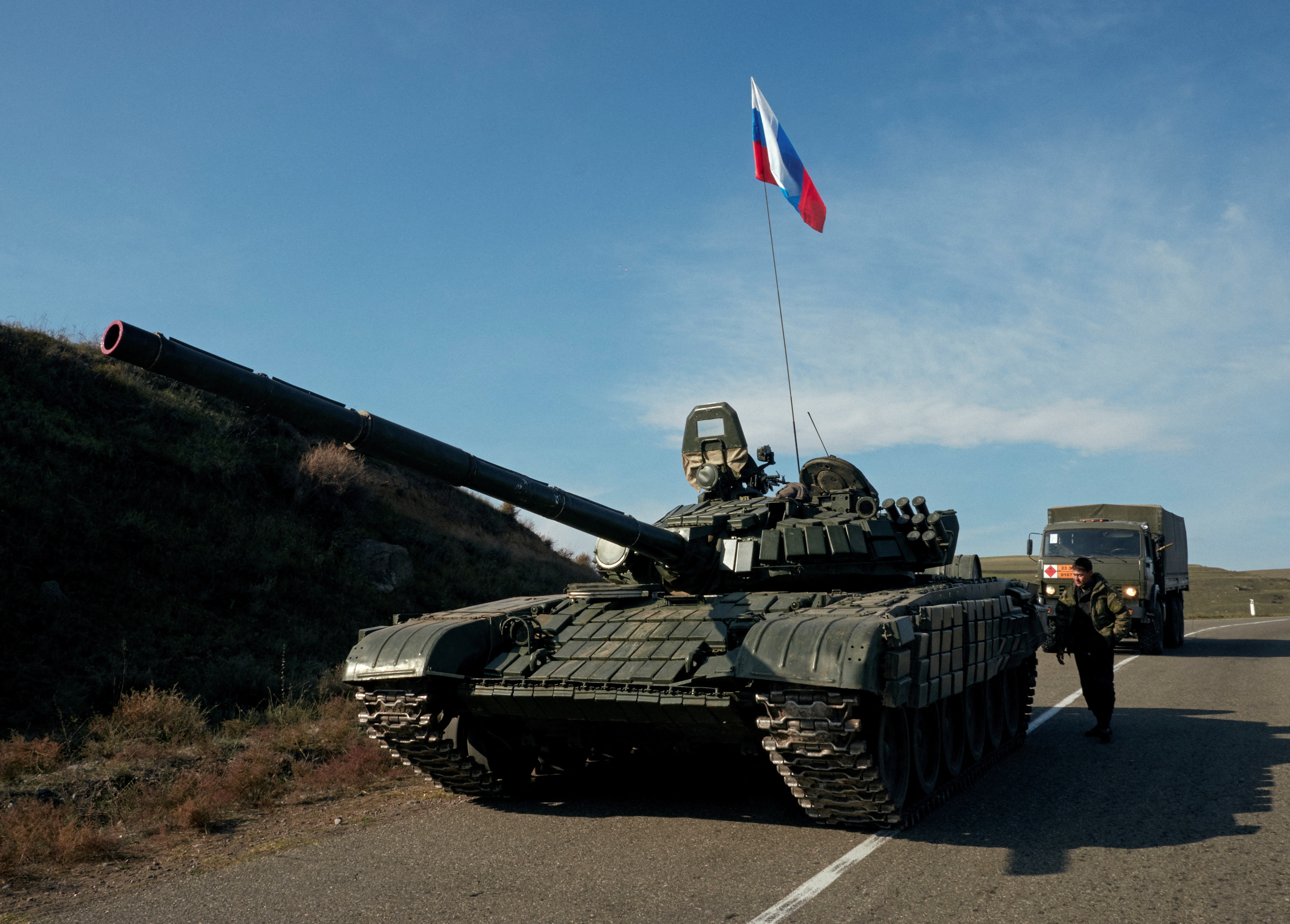 image Azerbaijani checkpoint blocks road next to Russians meant to keep it open