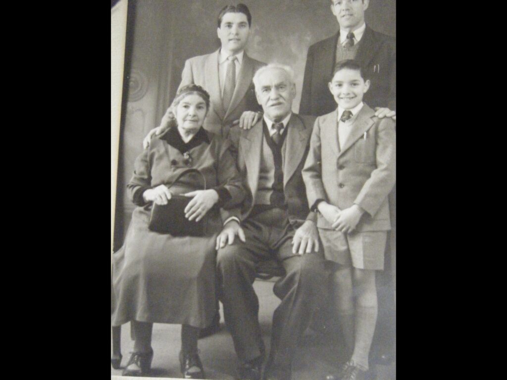 deniz as a young boy (bottom right) with his father, uncle and grandparents on a visit to the uk. his grandmother gave birth to 11 children