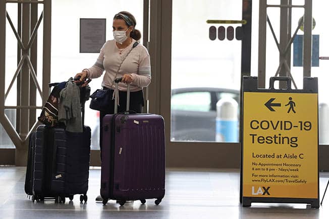 image Biden revokes COVID travel, federal employee vaccine requirements