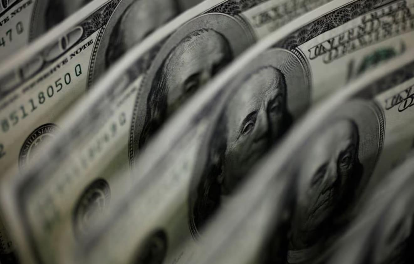 image Dollar under pressure as traders wait on loans data