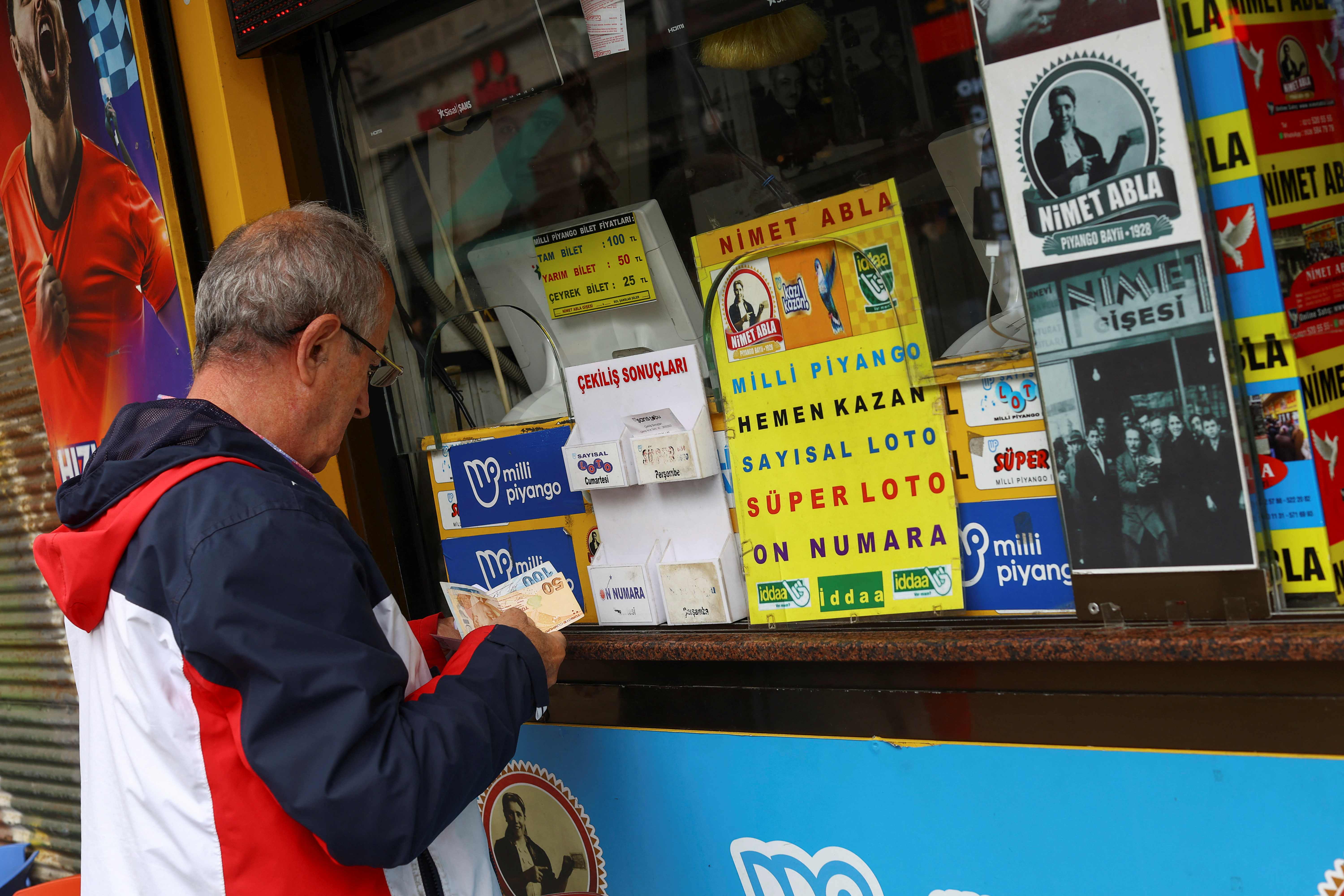 image Turkish lira teeters near record low as Erdogan secures victory