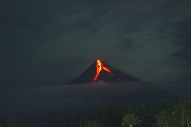 image 14,000 people evacuated as Philippine volcano spews lava