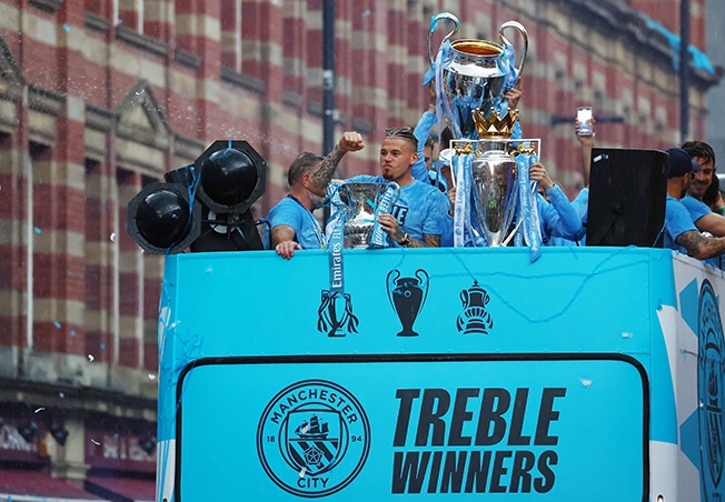 image Man City dance in the rain to celebrate treble
