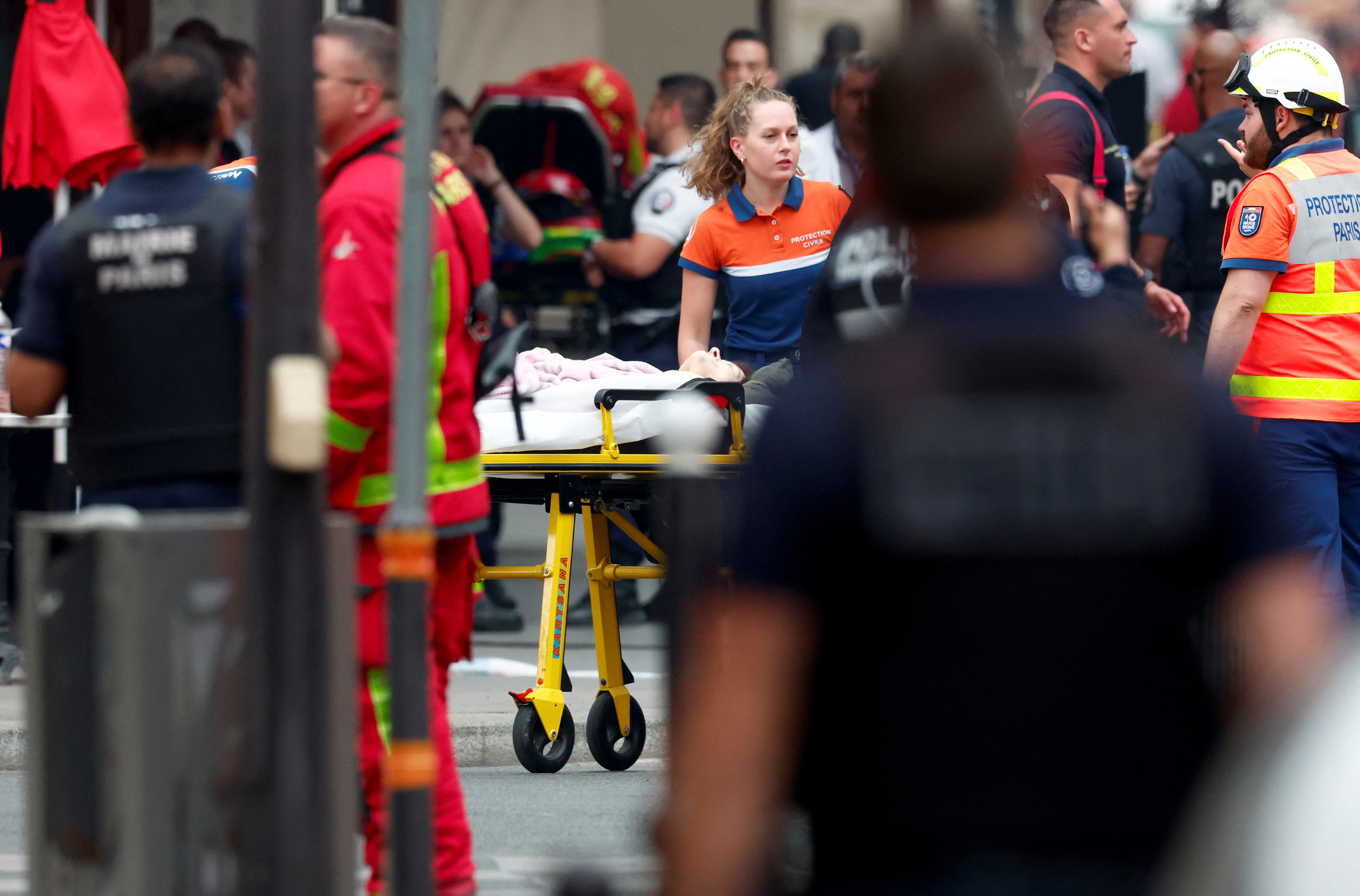 image After Paris blast, shaken locals wait anxiously nearby