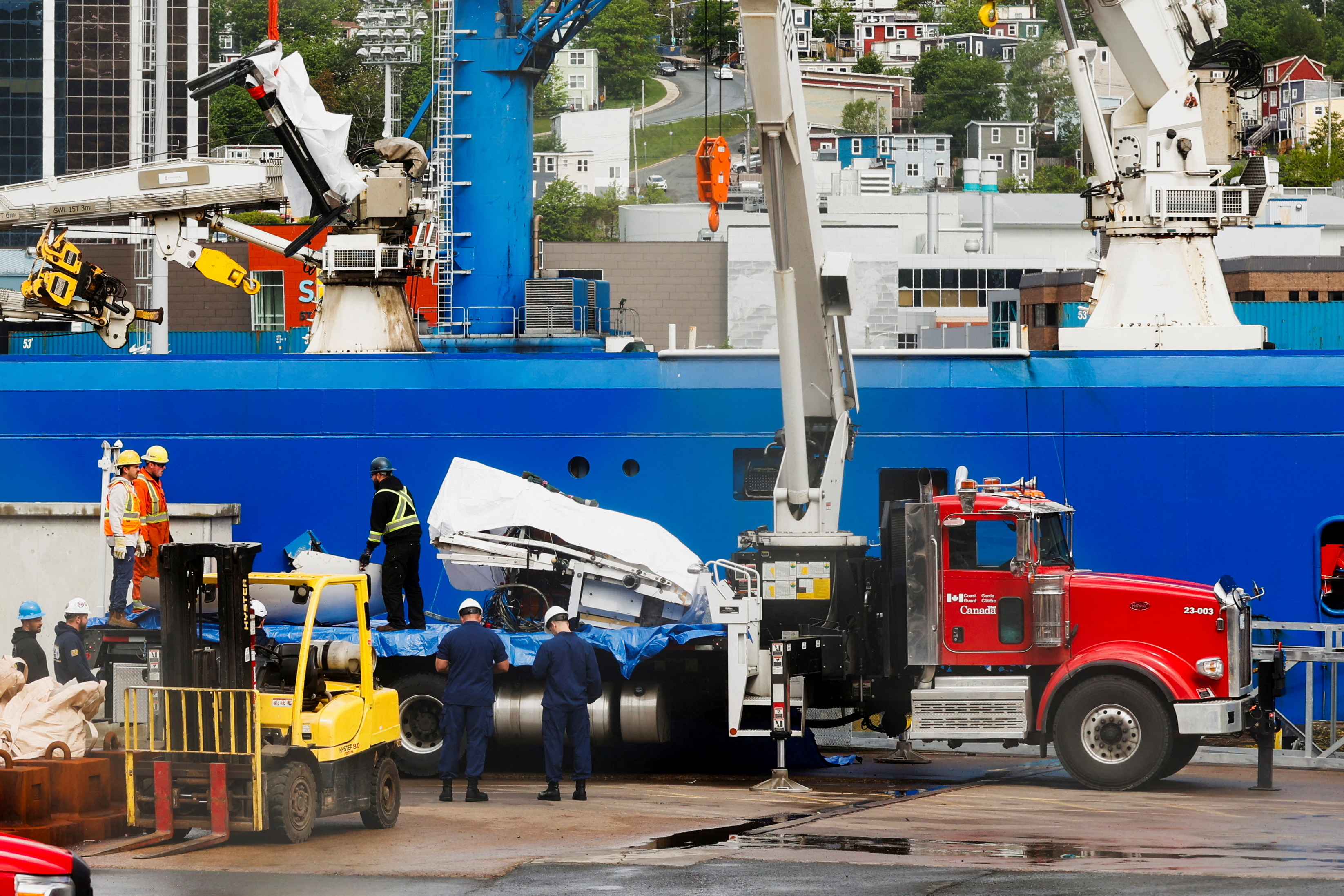 image Presumed human remains and shattered Titanic submersible returned to shore