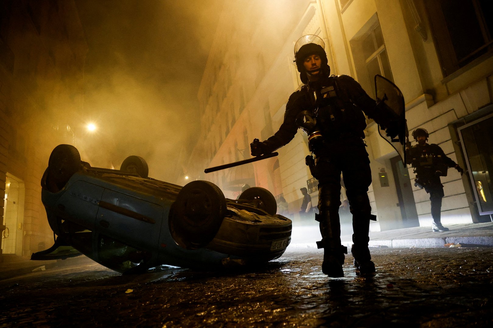 image Sporadic violence, but calmer night in France after family buries teenager (updated)