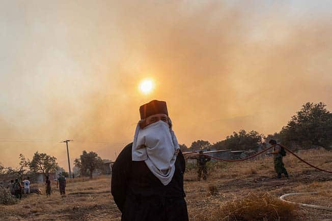 image Wildfires in Greece burn for days, more tourists expected to fly out