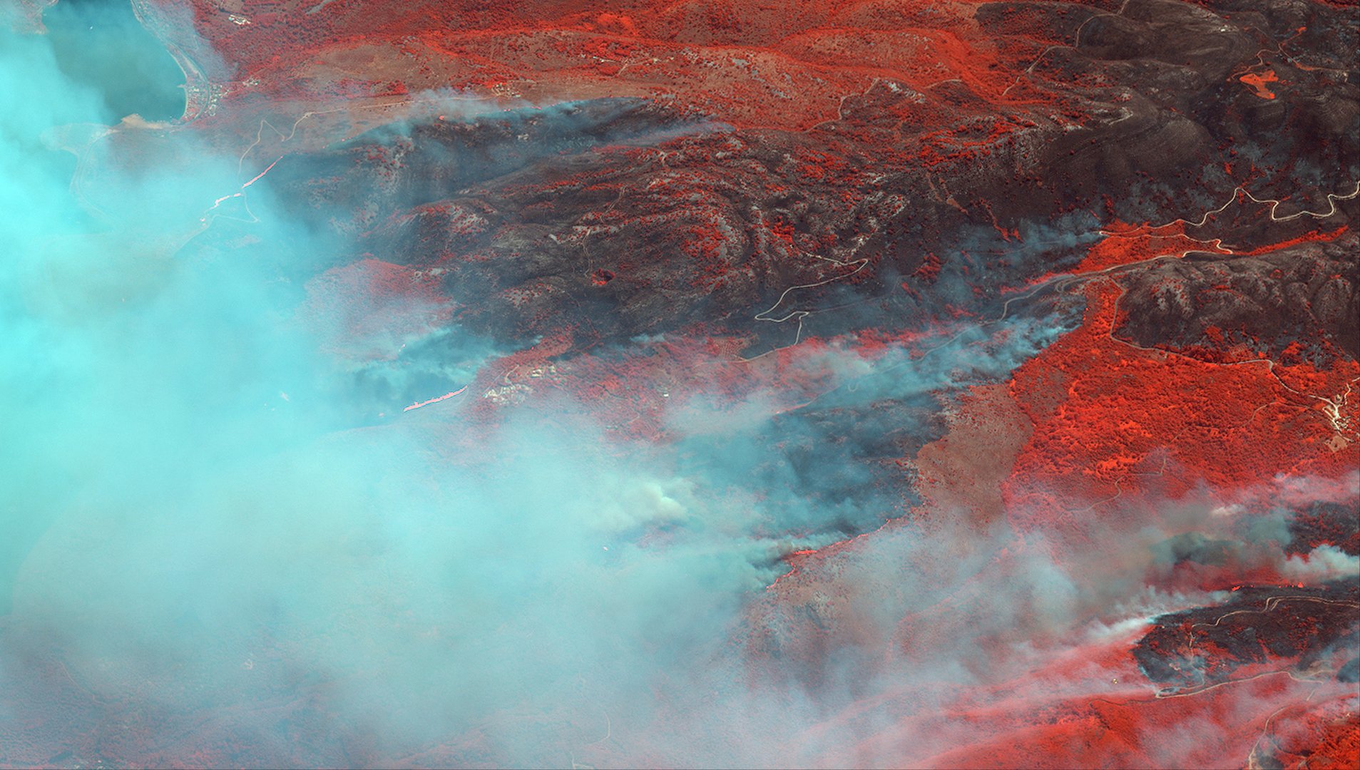 a satellite image shows an infrared overview as a wildfire burns greek island of corfu