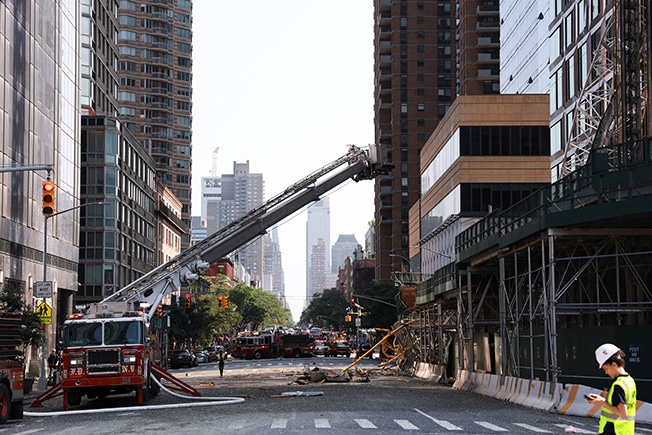 image Top of New York City crane crashes into street, injuring six