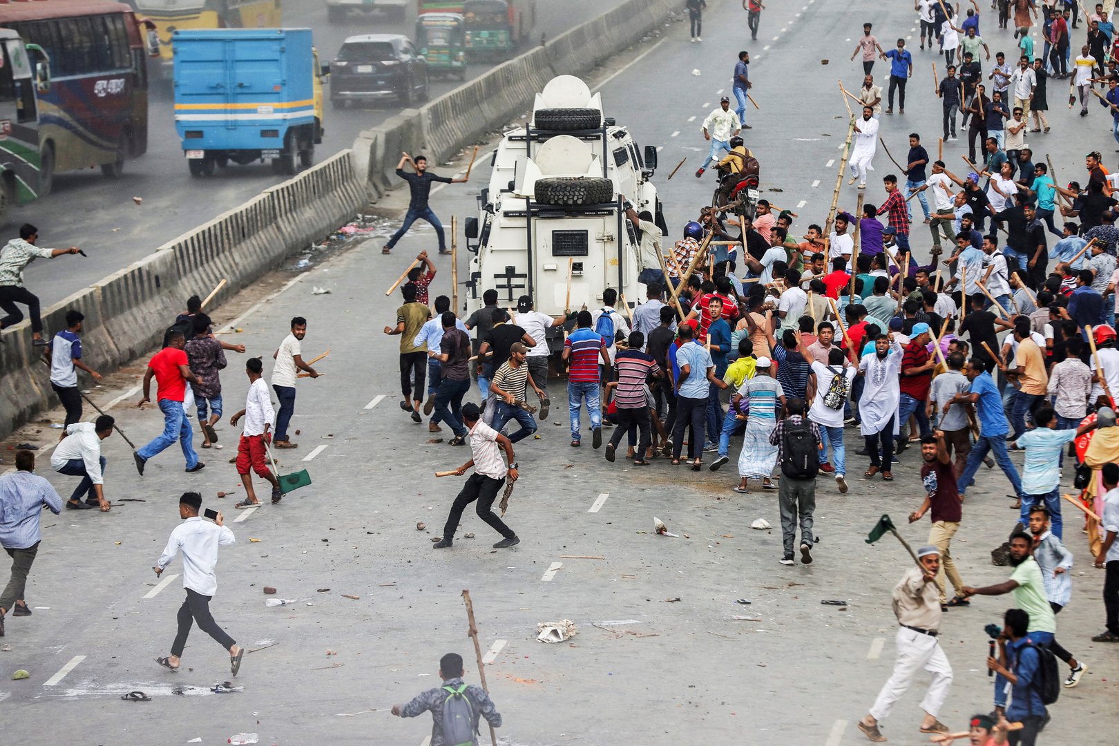 image Bangladesh police clash with opposition supporters calling on PM to resign
