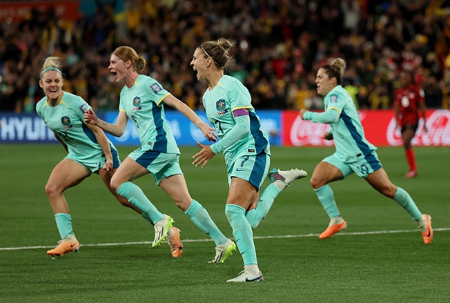 image Australia crush Canada 4-0 to reach World Cup knockouts