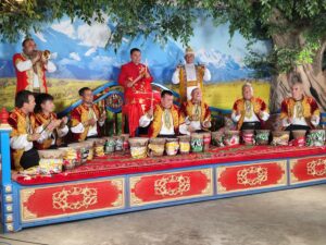 artists from hotan prefecture perform on a traditional heatable platform covered with a red carpet in turpan city china's xinjiang uygur autonomous region
