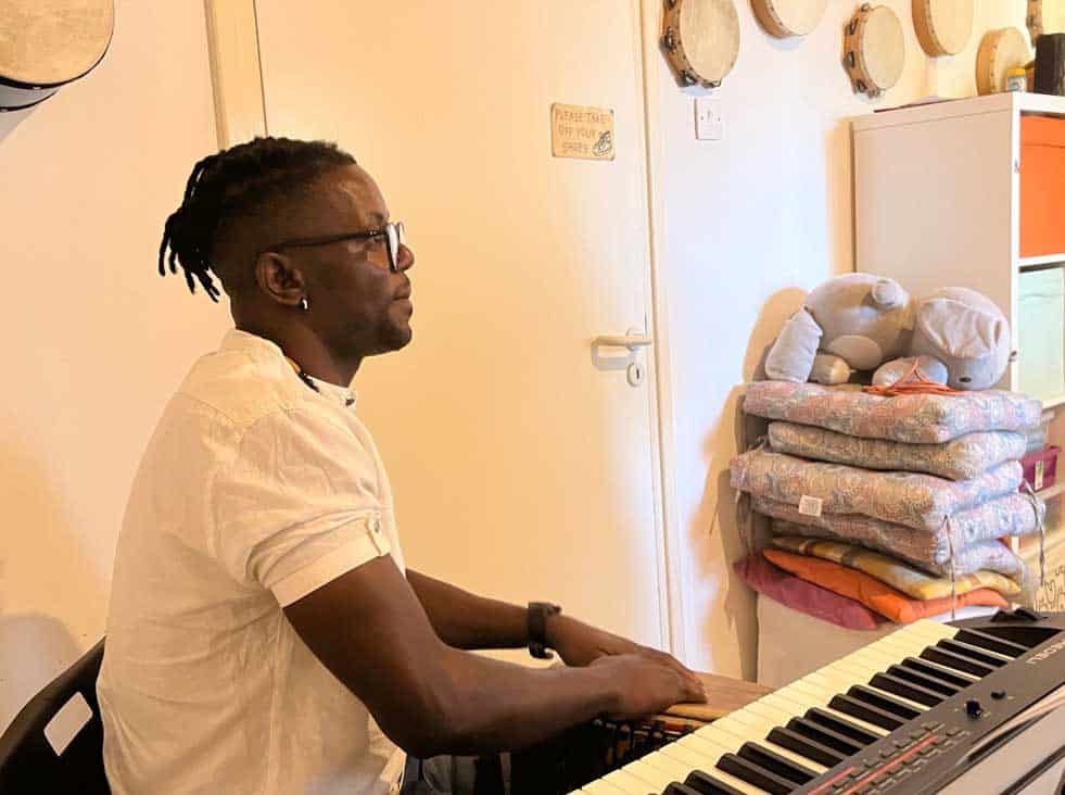 feature malia yves thieri harmonizes with mbiakop as he plays the djembe
